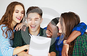 Group of happy students people friends with phones tablets gadgets laugh