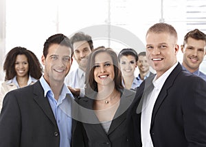 Group of happy successful business people smiling