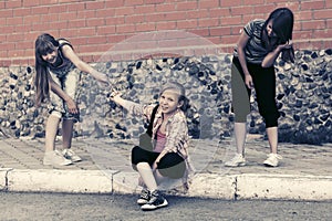 Group of happy teen girls on city street