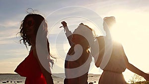 Group of happy women or girls dancing on beach 37