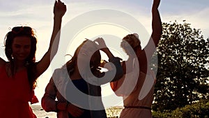 Group of happy women or girls dancing on beach 39