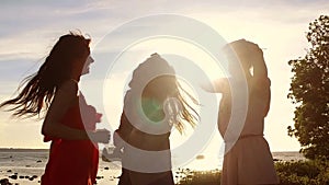 Group of happy women or girls dancing on beach 41