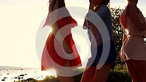 Group of happy women or girls dancing on beach 43