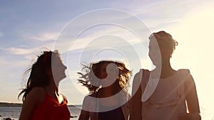 Group of happy women or girls dancing on beach 46