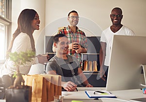 Group of happy young adults at small business