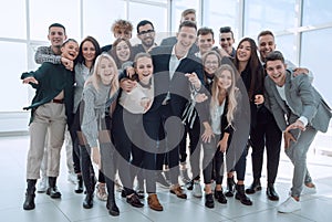 group of happy young business people pointing at you