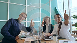 Group of Happy Young Mixed Race Business People Showing Thumbs Up in Office. 4K.