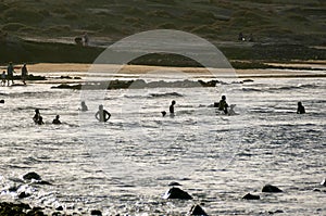 group of happy young people at the beach