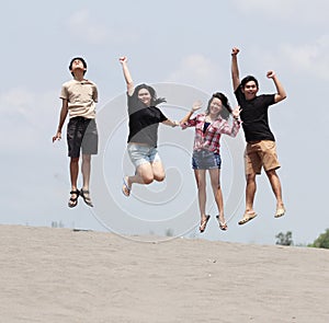 Group of happy young people enjoy with jumping