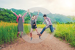 Group of happy young people jumping in the air.