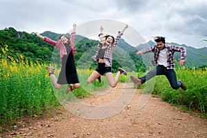 Group of happy young people jumping in the air.