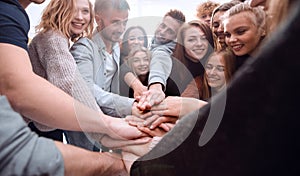 Group of happy young people showing their unity