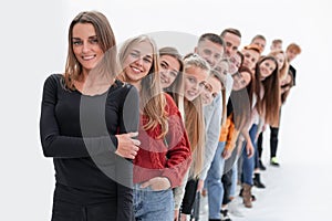 Group of happy young people standing in line