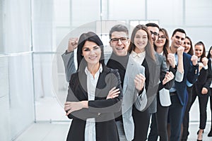 Group of happy young people standing in a row