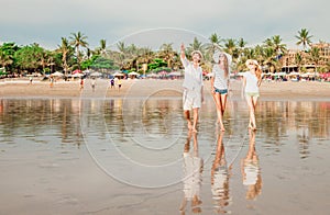 Group of happy young people walking along the