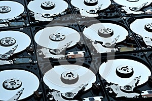 Group of hard disk drives. Many Open Hard drives. Close-up of the inside of PC hard drives. Technology background