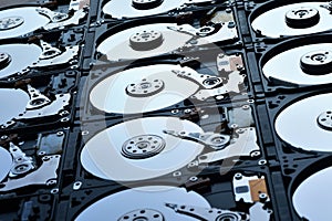 Group of hard disk drives. Many Open Hard drives. Close-up of the inside of PC hard drives. Technology background. Selective focus