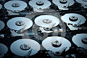 Group of hard disk drives. Many Open Hard drives. Close-up of the inside of PC hard drives. Technology background. Selective focus