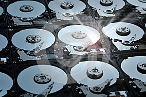Group of hard disk drives. Many Open Hard drives. Close-up of the inside of PC hard drives. Technology background. Selective focus