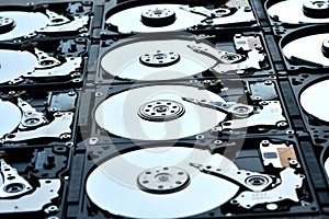 Group of hard disk drives. Many Open Hard drives. Close-up of the inside of PC hard drives. Technology background. Selective focus