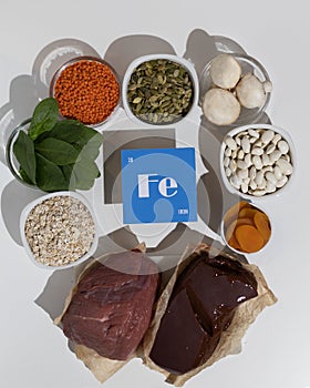 A group of healthy foods rich in iron. Healthy diet food. Cardboard sign with the inscription.