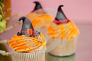 Group of helloween cupcakes on pink background. photo