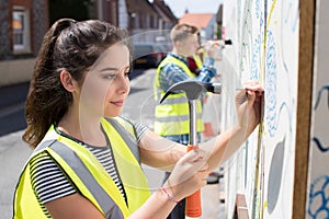 Group Of Helpful Teenagers Creating And Maintaining Community Ar