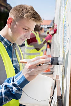 Group Of Helpful Teenagers Creating And Maintaining Community Ar