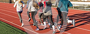 Group of young girls running on a track