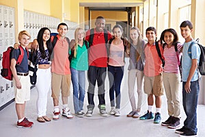 Group Of High School Students Standing In Corridor