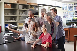 Group Of High School Students Taking Selfie In Biology Classroom