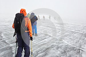 A group of hikers descending Margherita Glacier, Rwenzori Mountains