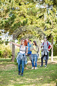 Group of hikers get hold something interesting