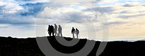 Group of hikers on the Ridgeway Trail across Barbury Castle photo