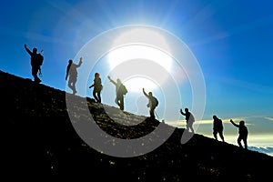 Group of hikers on the summit climber