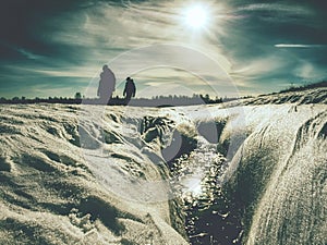 Group of hikers walking on snowy path