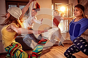 Group of hip hop girls jumping during music