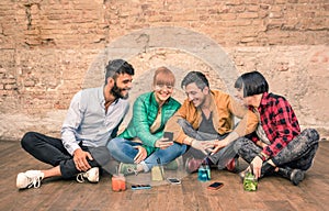 Group of hipster best friends with smartphones in grungy place