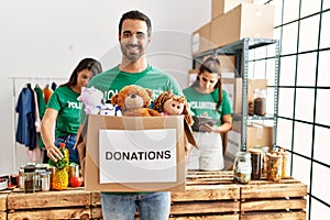 Group of hispanic volunteers working at charity center