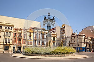 Group of historic modernist buildings a intricately designed street lamp called La Farola, city of CastellÃÂ³n, Valencia, Spain. photo