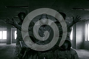Group of hooded hacker with mask standing photo