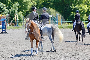 Group of horse riders waiting for dressage test