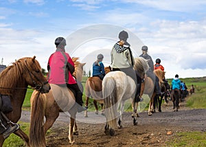 Group of horseback riders in Iceland. Travel beautiful country