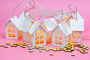 Group of houses with lights, wooden heart, community, villages, association , cooperation concept