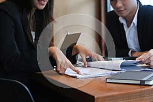 Group of human resources department reading resume document of an employee.