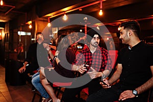 Group of indian friends at lounge bar.