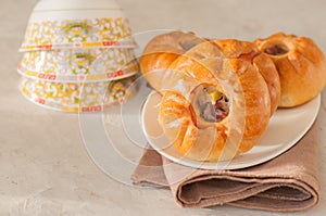 Group of individual pies with meat and potato - vak balish. Tatar traditional pies. White stone background. Close up and copy spa