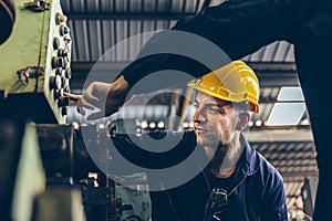 Group of Industrial factory maintenance engineers inspect relay protection system of machinery