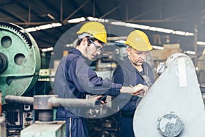 Group of industrial factory maintenance engineers inspect relay protection system using walkie talkie