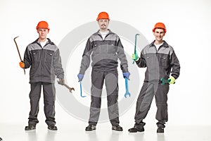 Group of industrial workers. Isolated over white background
